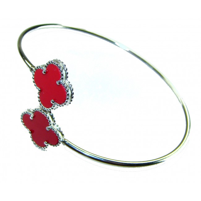 A Red four-leaf clover Coral .925 Sterling Silver handcrafted Bracelet - Bangle with red clover details in sterling silver, side view.