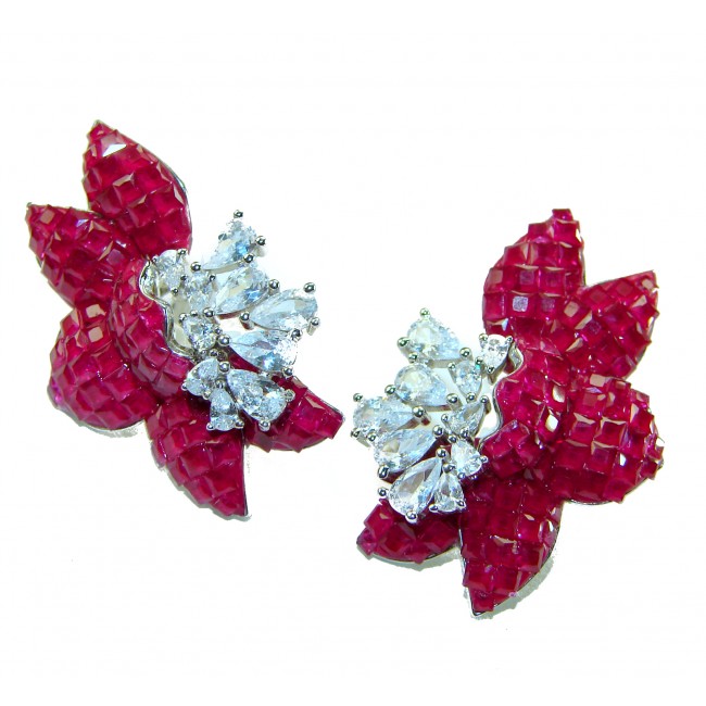 Magnificent Jewel 15.5 carat Ruby .925 Sterling Silver handcrafted incredible earrings - Earrings with rubies and diamonds close-up on white background