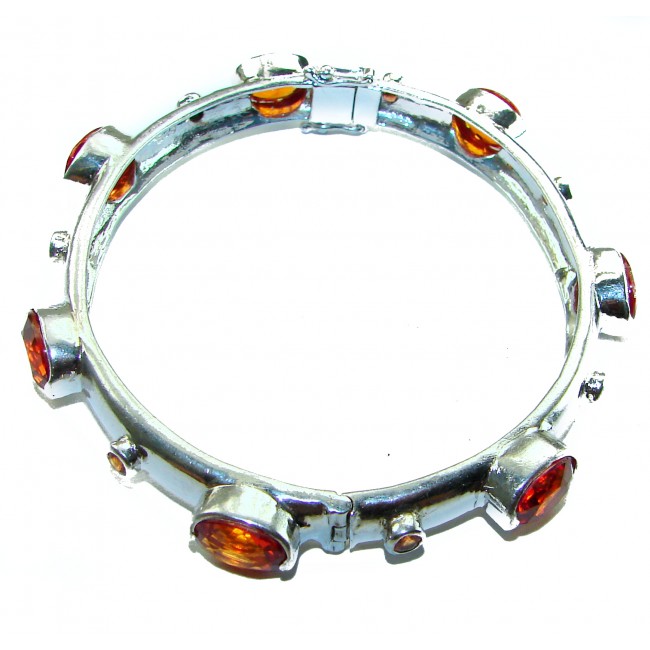 Red Galaxy Spectacular 25.2 carat authentic Ruby .925 Sterling Silver handmade bangle Bracelet - Silver bracelet with red stones, top view.