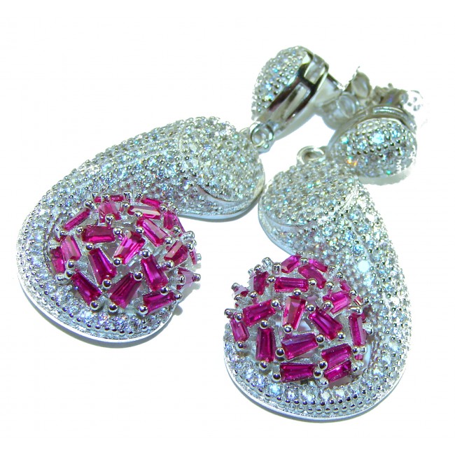 Pure Luxury 22.2 carat natural Ruby .925 Sterling Silver handmade Statement earrings - Close-up of ruby and sterling silver earrings with detailed design.
