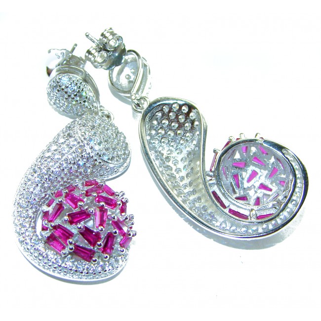 Pure Luxury 22.2 carat natural Ruby .925 Sterling Silver handmade Statement earrings - Front view of silver earrings with ruby stones and intricate design.