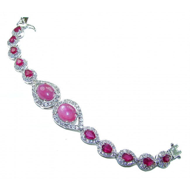 Dolce Vita - Precious Natural 52.5 carat Ruby black rhodium over .925 Sterling Silver handcrafted bracelet - Ruby bracelet with gemstones inlaid in a curved design, top view.