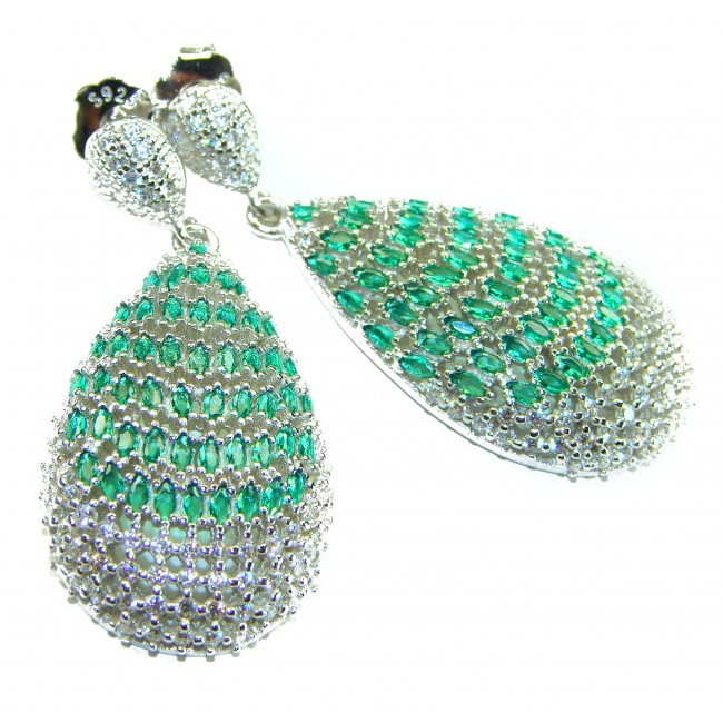 Magnificent Jewel - 17.5 carat natural EMERALD RHODIUM over .925 Sterling Silver handcrafted incredible earrings - Close-up of emerald-studded teardrop earrings with silver details.