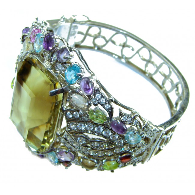 Ulimate Luxury - Large 72.5 carat Lemon Quartz .925 Sterling Silver handmade Statement Bracelet / Cuff - Side view of a luxury bracelet with large lemon quartz and colorful gems