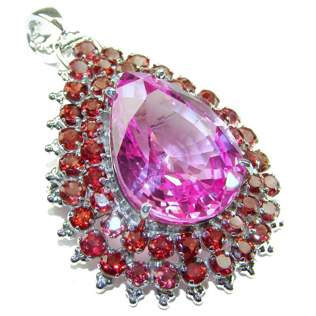 Royal Jewel - Blooming Garden - 42.5 CARAT Pink Sapphire .925 Sterling Silver handmade Pendant - Close-up of pink sapphire and red gemstone pendant, angled view.