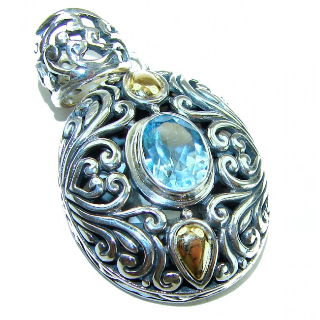Atlantica oval cut 5.9 carat Swiss Blue Topaz 14K Gold over .925 Sterling Silver Handcrafted Pendant
