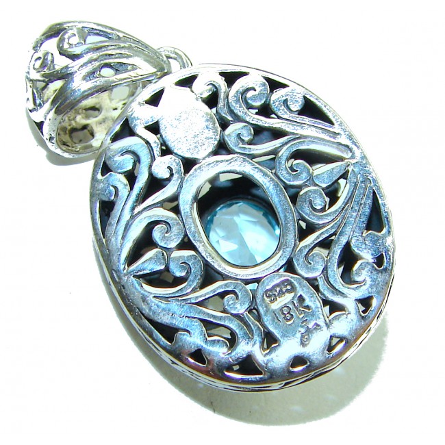 Atlantica oval cut 5.9 carat Swiss Blue Topaz 14K Gold over .925 Sterling Silver Handcrafted Pendant