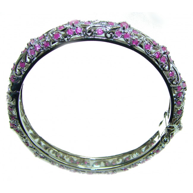 Precious Natural 17.5 carat Ruby .925 Sterling Silver handcrafted Bracelet - Silver bracelet with pink rubies, side view with intricate detailing.