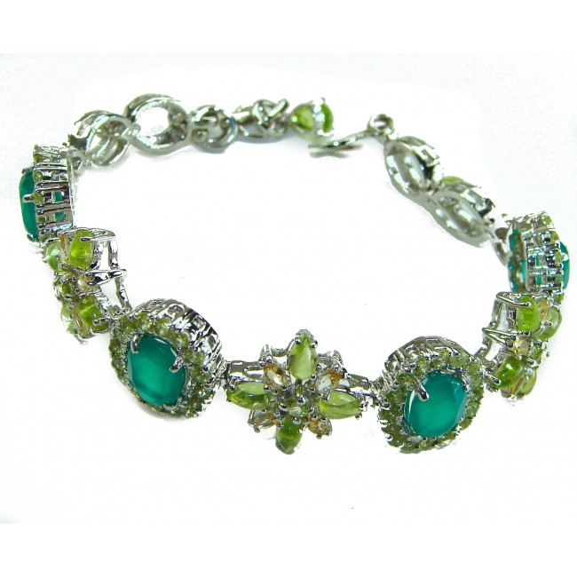 Victoria 49.5 ctw Colombian Emerald .925 Sterling Silver handcrafted Statement bracelet - Emerald bracelet side view, showcasing intricate silver settings.