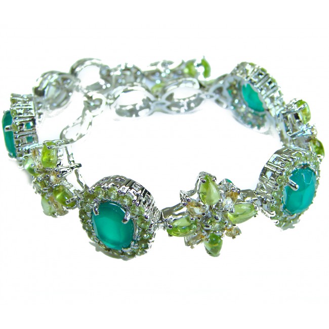 Victoria 49.5 ctw Colombian Emerald .925 Sterling Silver handcrafted Statement bracelet - Emerald and silver bracelet side view with intricate stone detail