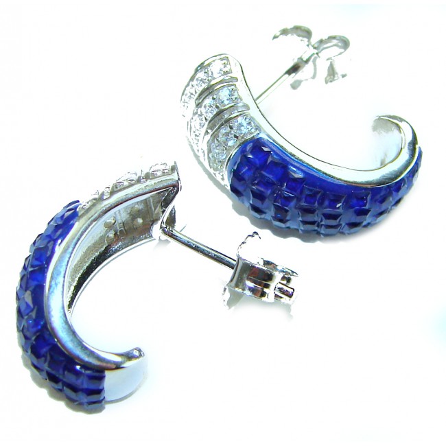 Blue Royalty 7.2 carat Sapphire .925 Sterling Silver .925 Sterling Silver Statement earrings - Close-up of blue sapphire and silver hoop earrings, side view.