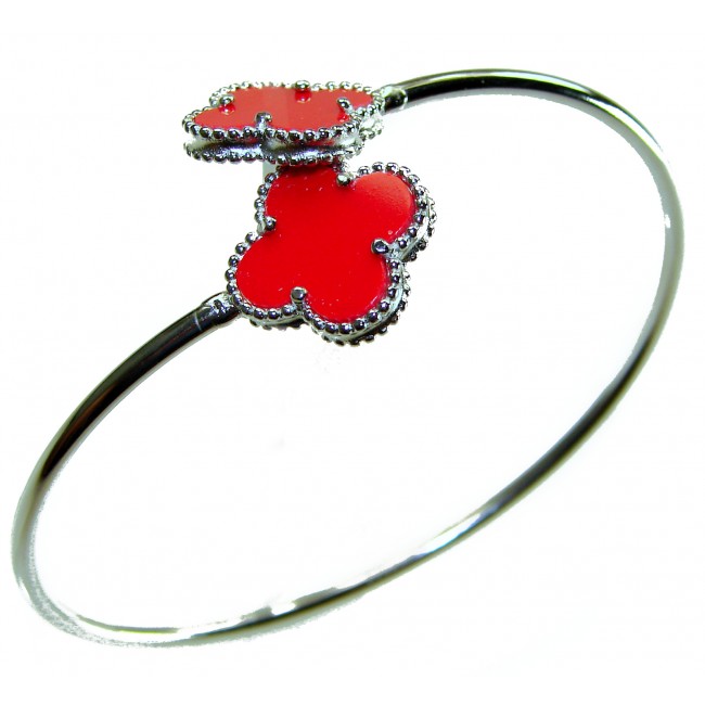 A Red four-leaf clover Coral .925 Sterling Silver handcrafted Bracelet - Silver bracelet with red clover charms, side view.