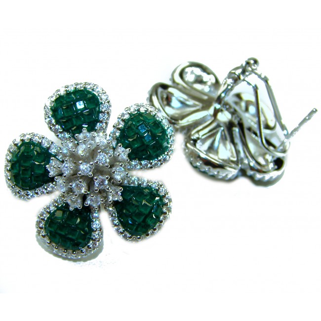 Born to Glam authentic 24.4 carat Colombian Emerald .925 Sterling Silver handcrafted Statement earrings - Flower-shaped emerald earrings, stone close-up, white background.