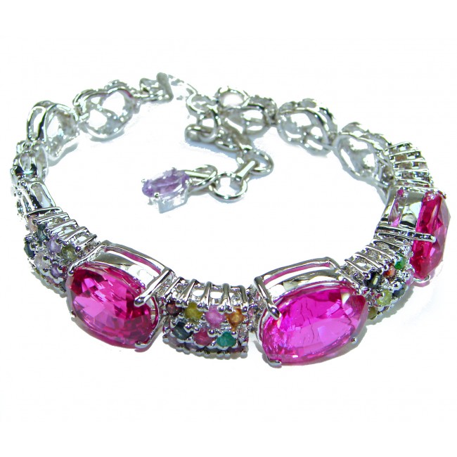 Tiffany - Unapologetically stunning Fuchsia Pink 125.5 carat Pink Sapphire RHODIUM OVER .925 Sterling Silver handcrafted Heavy Bracelet - Bracelet with fuchsia stones and clasp detail, angle view.
