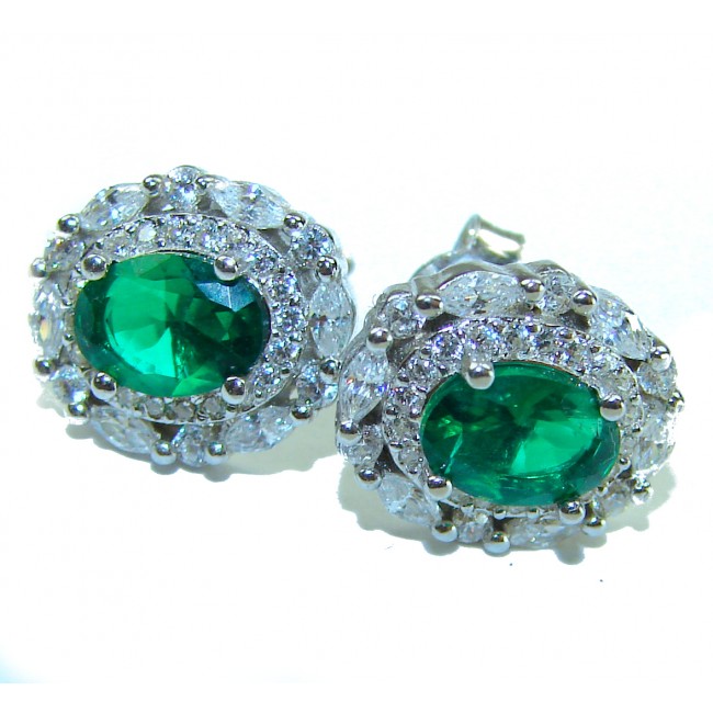Luxurious 4.5 carat Emerald .925 Sterling Silver handmade Statement earrings - Emerald earrings with diamond halo, side angle close-up.