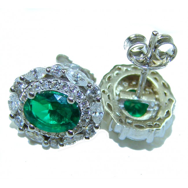 Luxurious 4.5 carat Emerald .925 Sterling Silver handmade Statement earrings - Emerald stud earrings close-up in sterling silver setting.