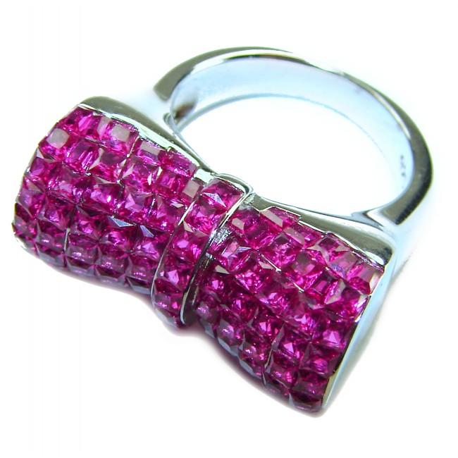 Luxurious Bow - natural 15.5 carat Ruby .925 Sterling Silver handmade Statement Ring size 6 1/2 - Bow-shaped ring with 15.5 carat rubies on sterling silver, angled view.