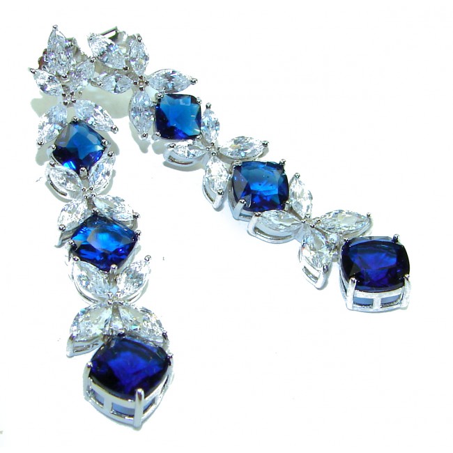 Gabriella 15.2 carat authentic Sapphire rhodium over .925 Sterling Silver handcrafted Statement earrings - Earrings with sapphires and clear stones, side view.