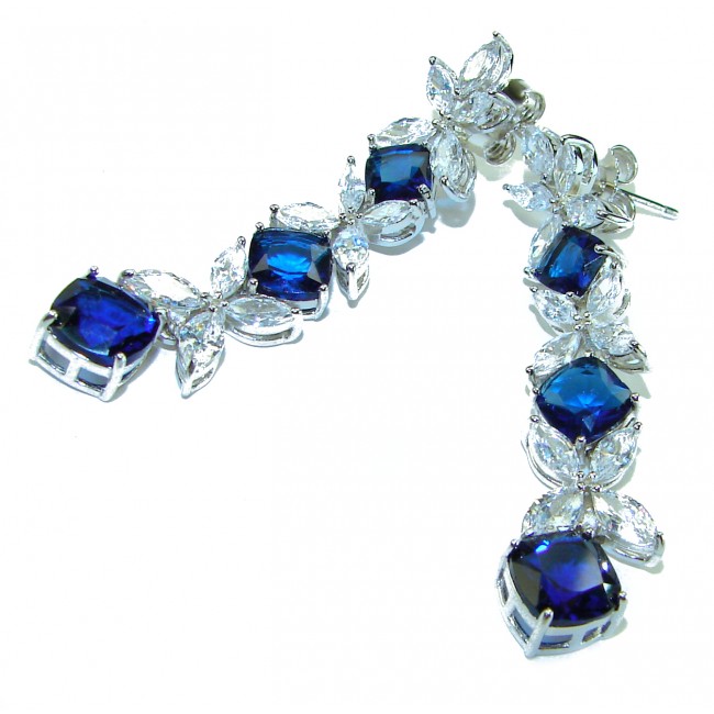 Gabriella 15.2 carat authentic Sapphire rhodium over .925 Sterling Silver handcrafted Statement earrings - Close-up of Gabriella sapphire earrings with clear stones, front view.