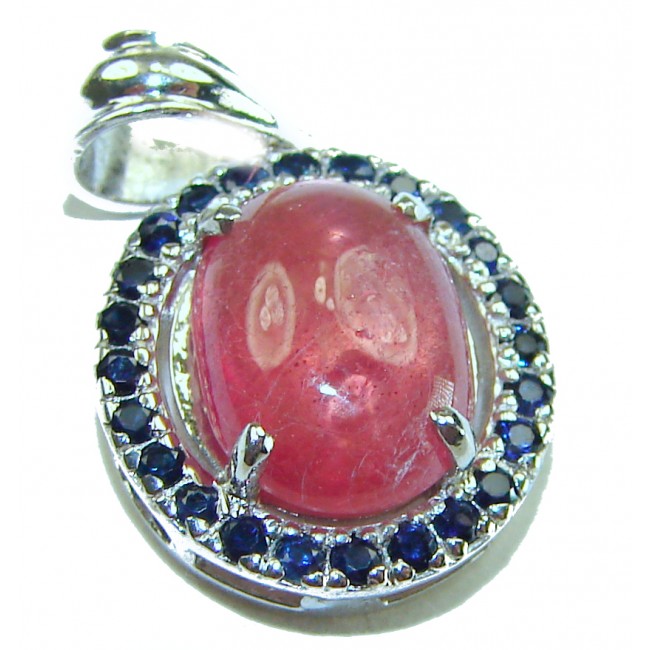 Melissa - Authentic 8.7 carat Ruby .925 Sterling Silver handcrafted Pendant - Close-up of ruby pendant in sterling silver with blue gemstone accents.