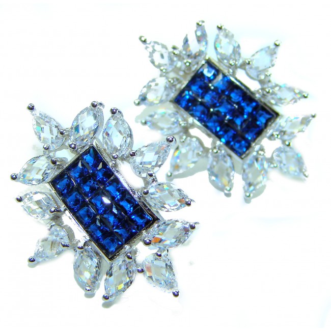 Born to Glam authentic 10.5 carat Sapphire .925 Sterling Silver handcrafted earrings - Close-up of sapphire and sterling earrings on white background