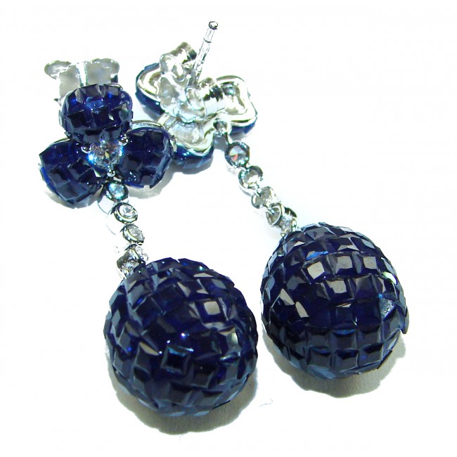 Giovanna - Authentic 21.9 carat Sapphire .925 Sterling Silver handcrafted earrings - Close-up of sapphire and silver earrings on white background.