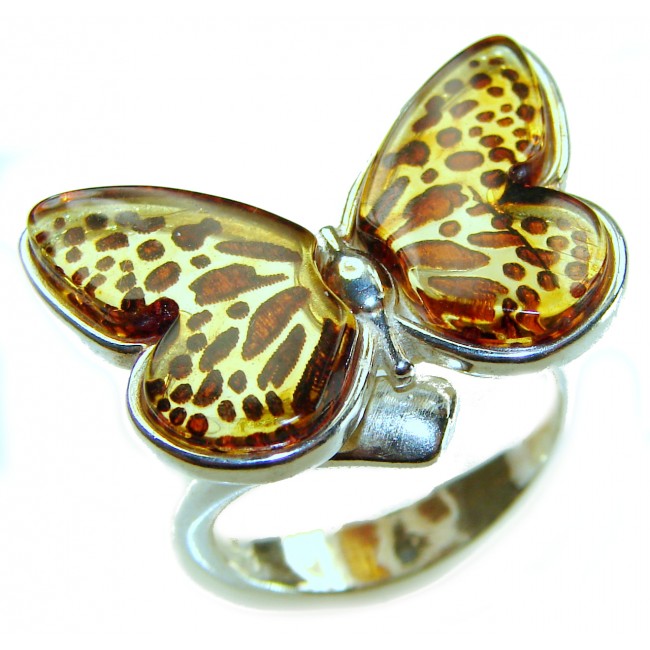 Butterfly Authentic carved Baltic Amber .925 Sterling Silver handcrafted ring; s. 8 adjustable - Close-up of butterfly-shaped amber and silver ring.