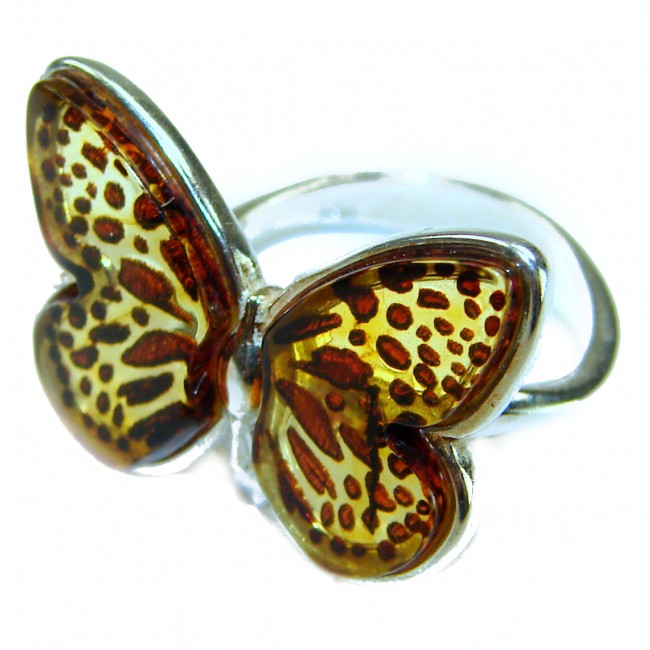 Butterfly Authentic carved Baltic Amber .925 Sterling Silver handcrafted ring; s. 8 adjustable - Close-up of butterfly-shaped Baltic amber and sterling silver ring.