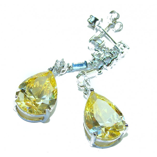 Luxurious Oval cut 8.5 carat Yellow Sapphire .925 Sterling Silver handcrafted earrings - Close-up of luxurious yellow sapphire earrings in .925 sterling silver