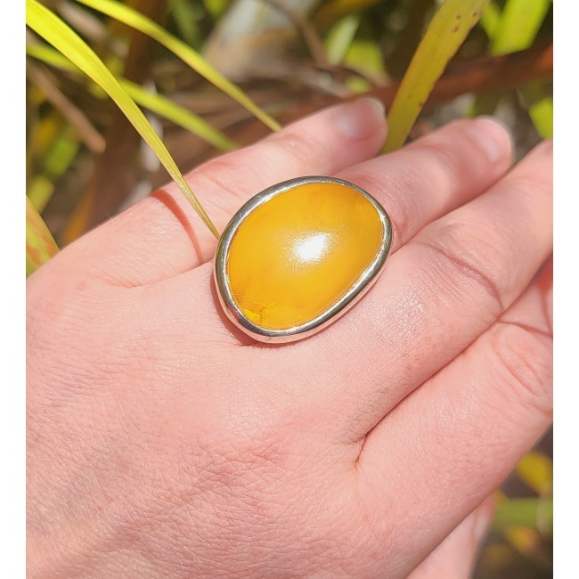 Authentic Golden Butterscotch Baltic Amber .925 Sterling Silver entirely handcrafted ring; s. 7 adjustable - Golden butterscotch amber ring worn on hand, close-up.