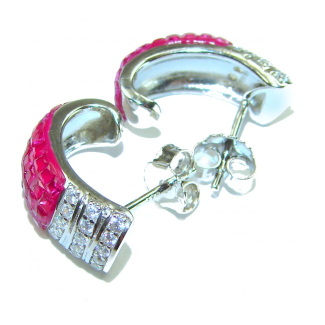 Real Beauty natural mystery setting 14.2 carat Ruby .925 Sterling Silver handcrafted earrings - Side view of ruby and diamond stud earrings in silver setting.