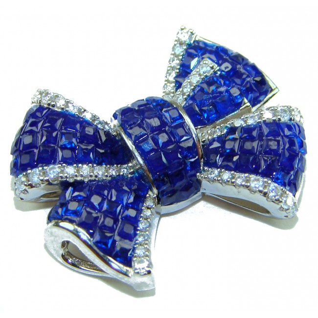 Heirloom blue Bow Genuine 17.5 carat Sapphire .925 Sterling Silver handmade Pendant - Blue sapphire bow brooch with diamond accents, top view.