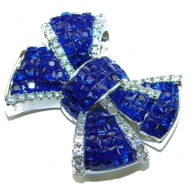Heirloom blue Bow Genuine 17.5 carat Sapphire .925 Sterling Silver handmade Pendant - Close-up of heirloom blue bow sapphire brooch with silver accents.