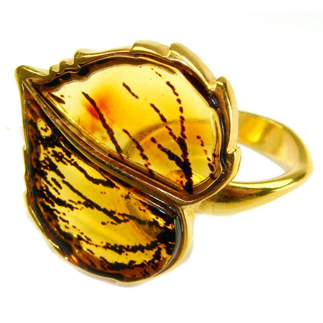 Authentic carved Baltic Amber .925 Sterling Silver dipped in 18K Gold handcrafted ring; s. 8 adjustable - Close-up of carved Baltic amber ring in silver with gold dip.