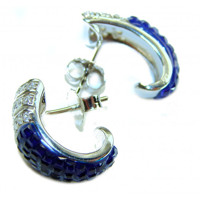 Born to Glam authentic 10.5 carat Sapphire .925 Sterling Silver handcrafted earrings - Close-up of sapphire and sterling silver earrings from side angle.
