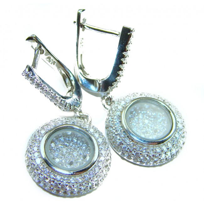 Floating Memories 11.5 carat White Topaz .925 Sterling Silver Handcrafted Statement earrings - Close-up of white topaz earrings with clasps, sparkling detail.