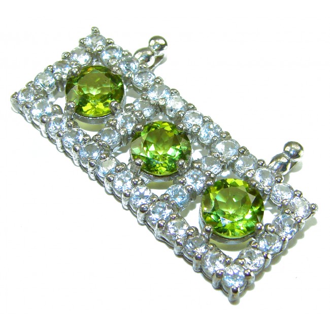 Mystery 22.6 carat Green Peridot .925 Sterling Silver handcrafted pendant - Close-up of green peridot stones in sterling silver setting.