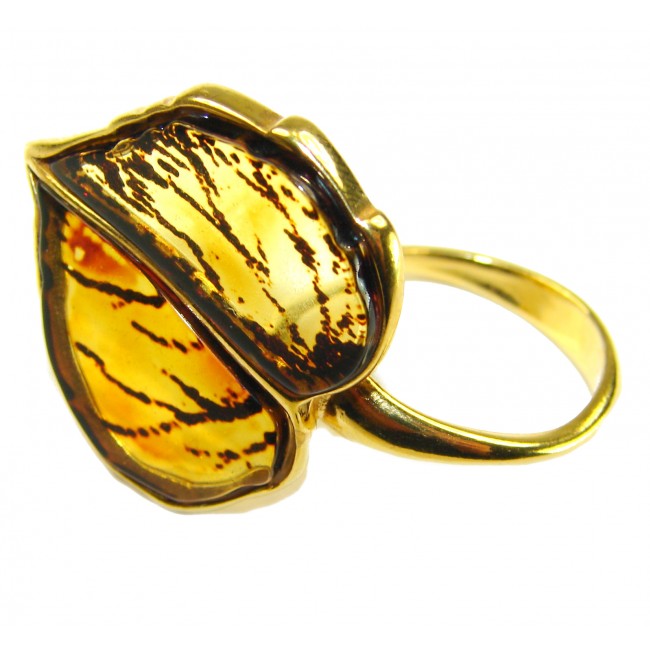 Authentic carved Baltic Amber .925 Sterling Silver dipped in 18K Gold handcrafted ring; s. 8 adjustable - Close-up of a Baltic Amber ring, side view, in sterling silver dipped.