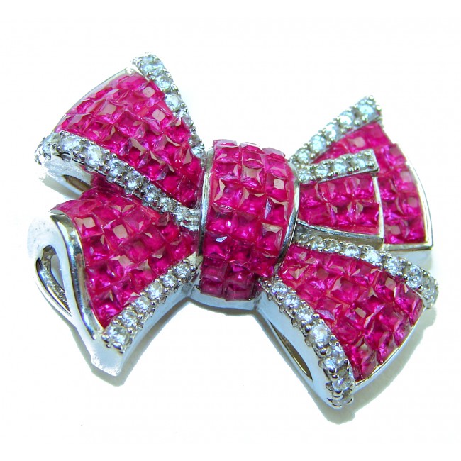 Heirloom blue Bow Genuine 17.5 carat Ruby .925 Sterling Silver handmade Pendant - Close-up of heirloom bow jewelry with rubies and sterling silver.