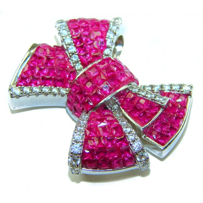 Heirloom blue Bow Genuine 17.5 carat Ruby .925 Sterling Silver handmade Pendant - Close-up of heirloom bow-shaped ruby and diamond pendant.