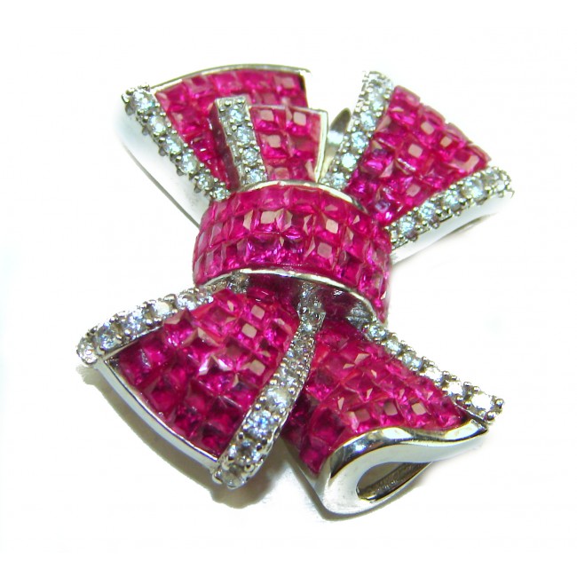 Heirloom blue Bow Genuine 17.5 carat Ruby .925 Sterling Silver handmade Pendant - Ruby bow brooch with diamond accents, top angle view.