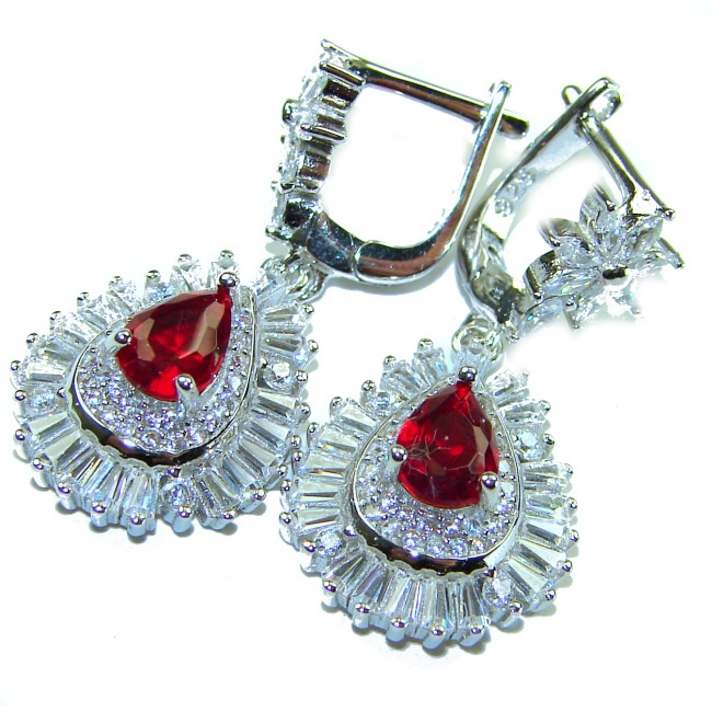 Magnificent Jewel 4.5 carat Ruby .925 Sterling Silver handcrafted incredible earrings - Elegant ruby earrings in close-up showcasing stones and silver detailing.