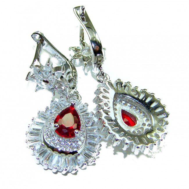 Magnificent Jewel 4.5 carat Ruby .925 Sterling Silver handcrafted incredible earrings - Close-up of ruby earrings with intricate .925 sterling silver detailing.