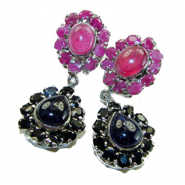 Giovanna - Very Unique - 29.5 carat Sapphire Ruby .925 Sterling Silver dipped in rhodium handcrafted earrings - Close-up of ruby and sapphire earrings with silver setting.