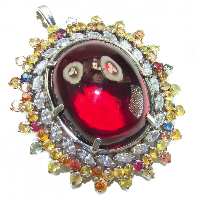Oversized! Rare finding! Deluxe 67.2 carat authentic Red Topaz rhodium over .925 Sterling Silver handmade Statement Pendant - Close-up of deluxe 67.2 carat red gemstone pendant with multicolor accents.