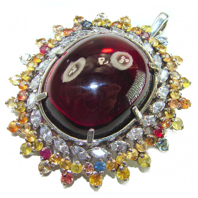 Oversized! Rare finding! Deluxe 67.2 carat authentic Red Topaz rhodium over .925 Sterling Silver handmade Statement Pendant - Close-up of deluxe 67.2 carat red gemstone pendant with colorful accents.