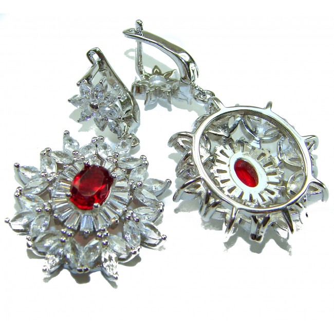Magnificent Jewel 8.5 carat Ruby .925 Sterling Silver handcrafted incredible earrings - Close-up of earrings with ruby center and sterling silver detailing