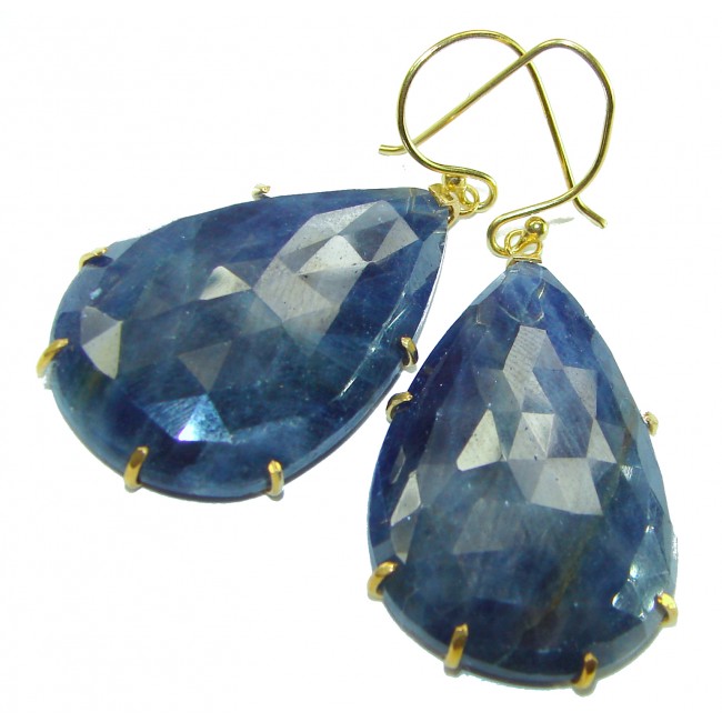Giovanna - Authentic oval cut 27.9 carat faceted SAPPHIRE .925 Sterling Silver handcrafted earrings - Close-up of faceted sapphire earrings with gold hooks.