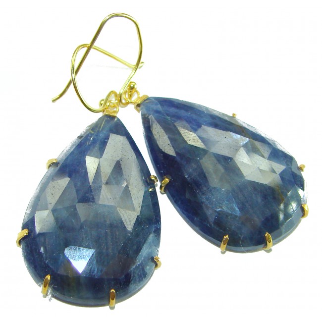 Giovanna - Authentic oval cut 27.9 carat faceted SAPPHIRE .925 Sterling Silver handcrafted earrings - Close-up of faceted sapphire earrings with gold prongs.