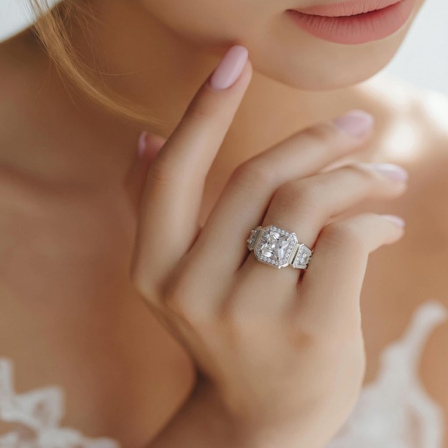 LUXURIUS 6.5 carat White Topaz .925 Sterling Silver ring size 7 - Close-up of a 6.5 carat white topaz ring worn on a hand.